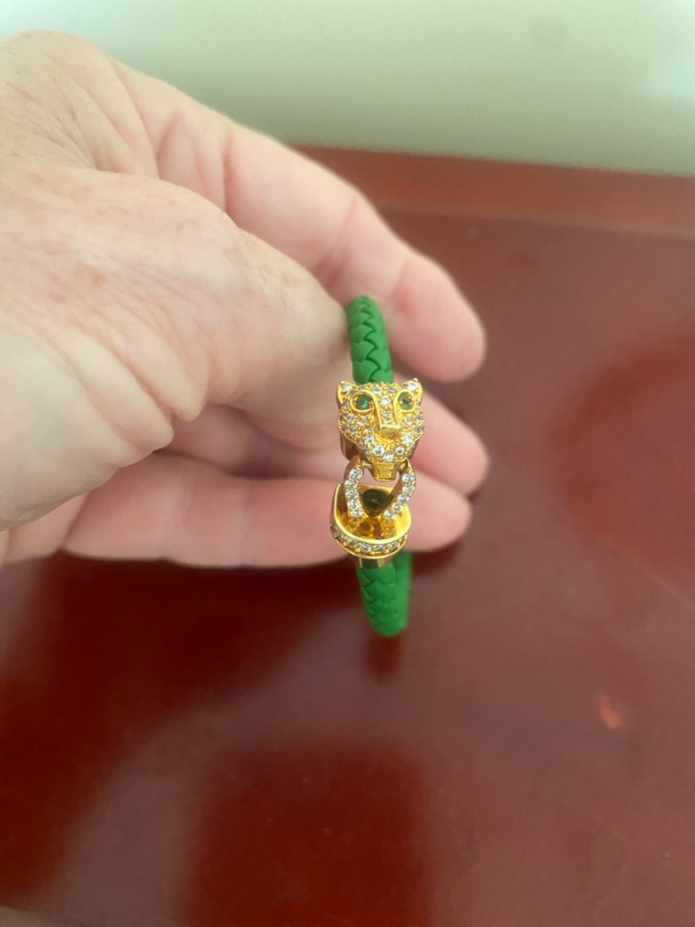 Green Braided Leather Bracelet with Gold Lion Head Clasp